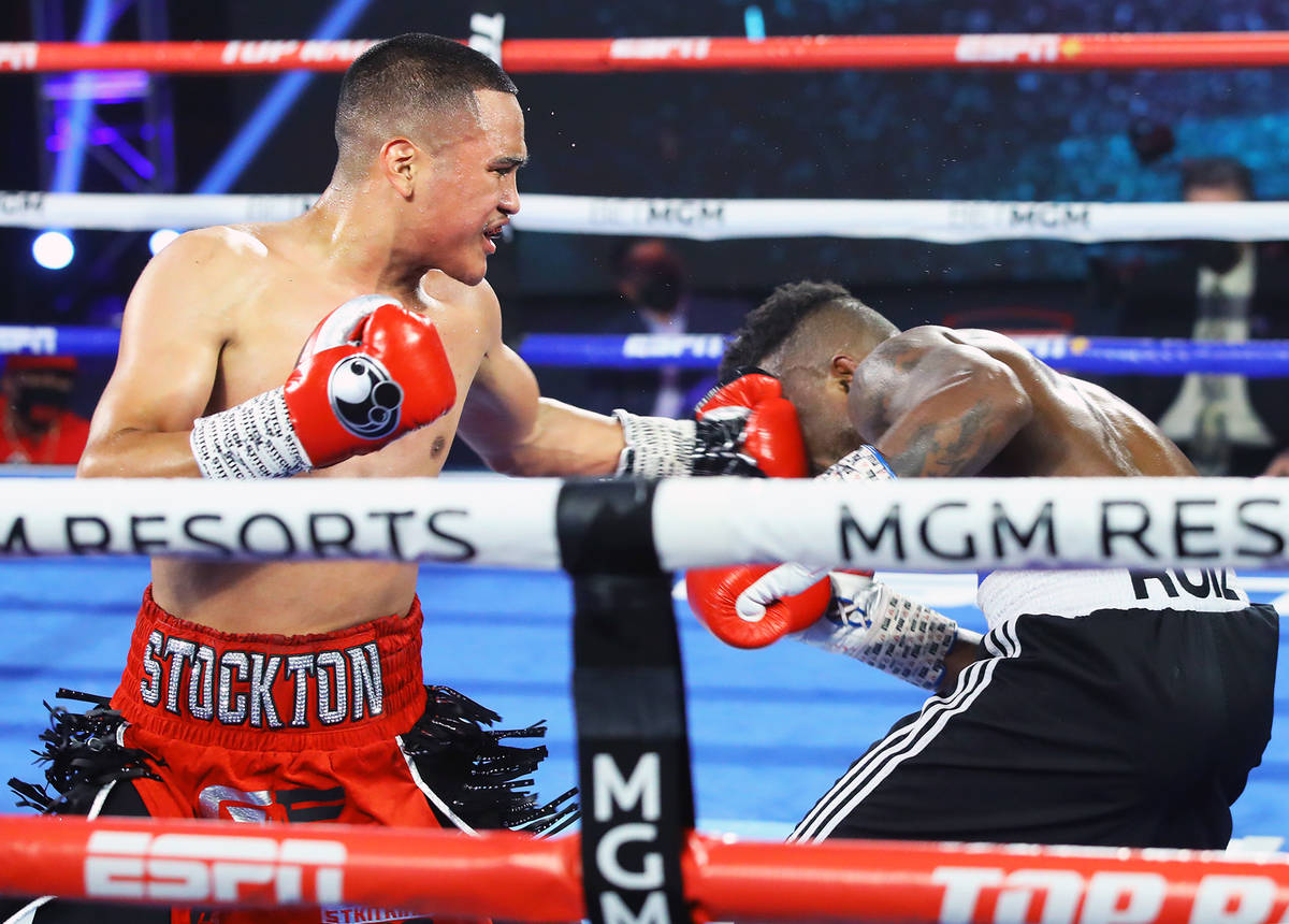 Gabriel Flores Jr., left, lands a punch against Josec Ruiz during their lightweight fight Thurs ...