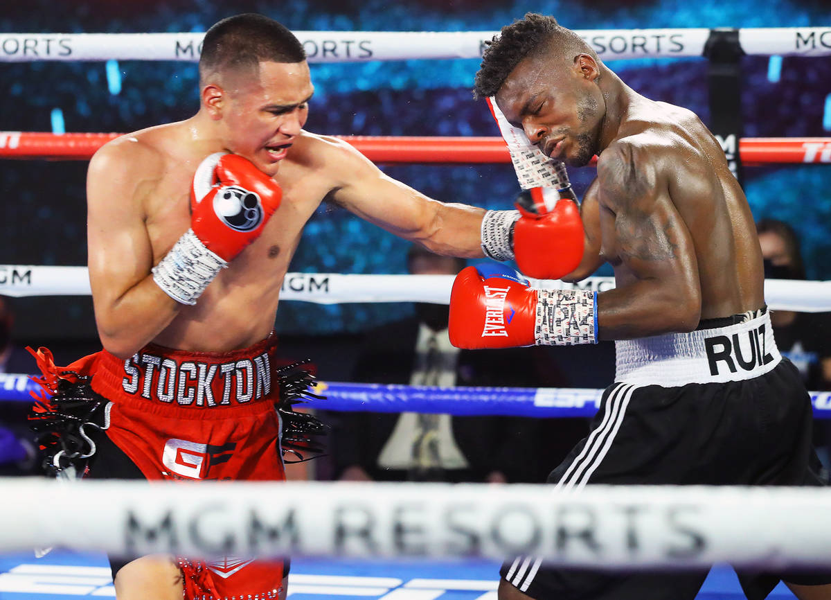 Gabriel Flores Jr., left, lands a punch against Josec Ruiz during their lightweight fight Thurs ...