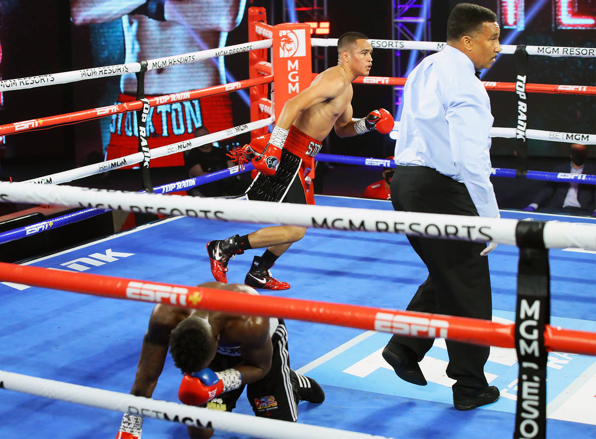 Gabriel Flores Jr. knocks down Josec Ruiz during their lightweight fight Thursday, June 18, 202 ...