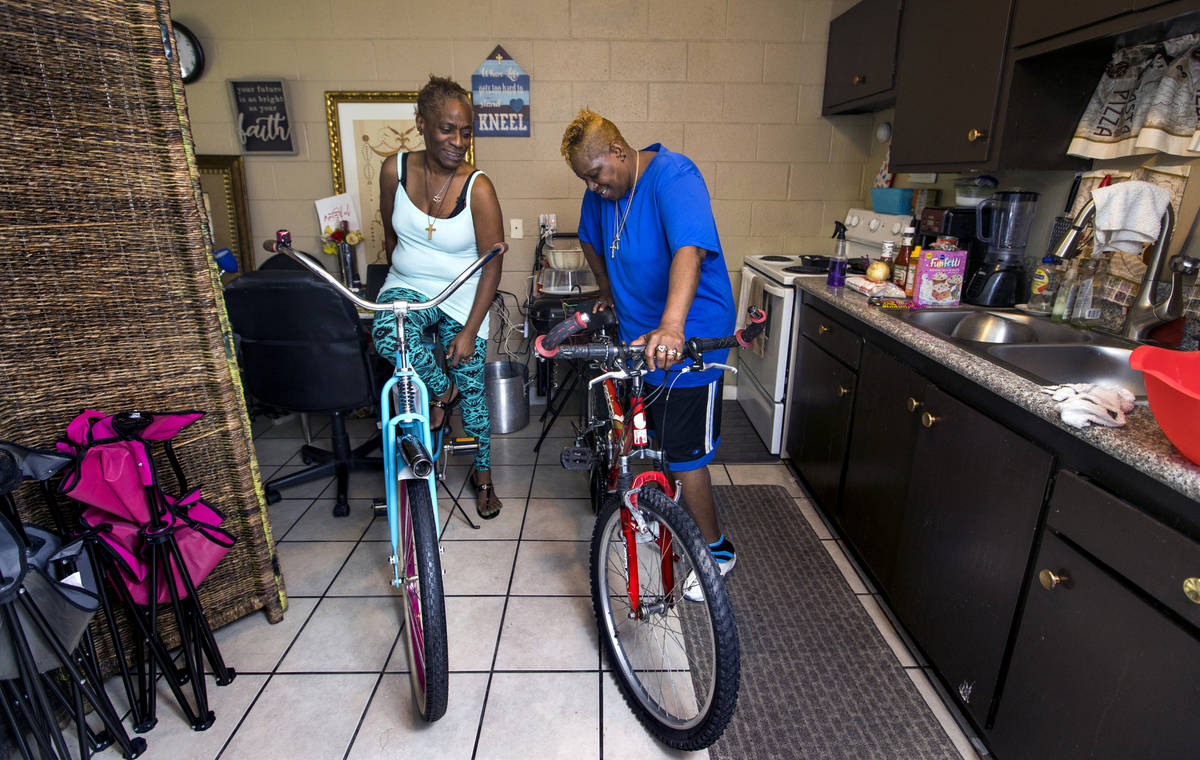 Helen Clark, left, and wife Audrey Palmer with their cherished bicycles on Friday, June 19, 202 ...