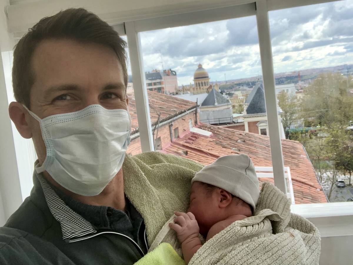 Henderson native and Air Force Maj. Chris Stein hold his newborn baby girl, Sadie, after her ho ...