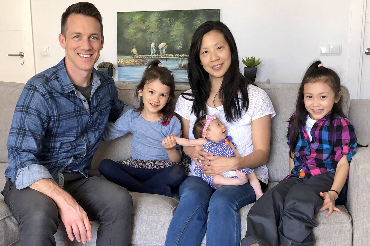 Henderson native and Air Force Maj. Chris Stein and his wife, Sarah, smile with their daughters ...