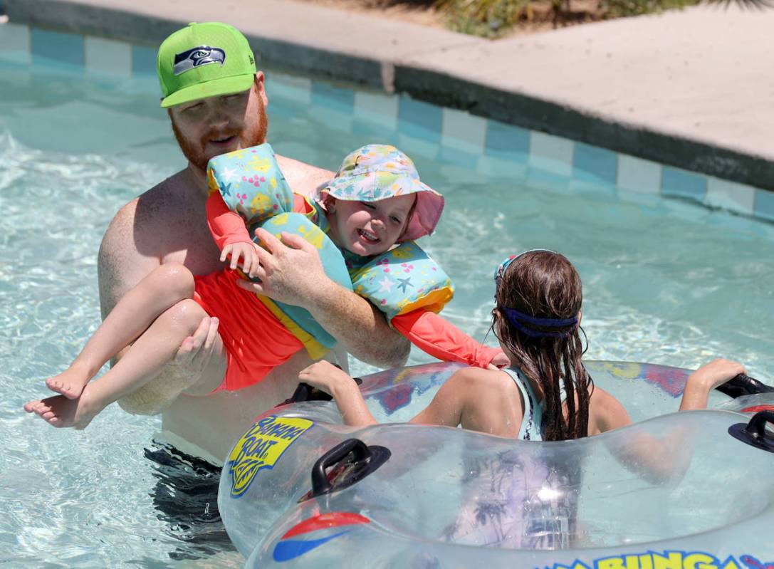Andrew Arrington bucks off his daughter Danielle Arrington, 3, and niece Emily Artl, 6, at the ...