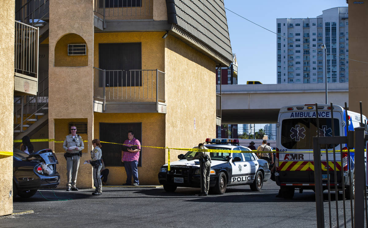 Las Vegas police investigate the scene of a homicide around a Siegel Suites at Bonanza Road and ...