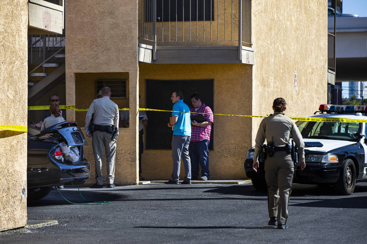 Las Vegas police investigate the scene of a homicide around a Siegel Suites at Bonanza Road and ...