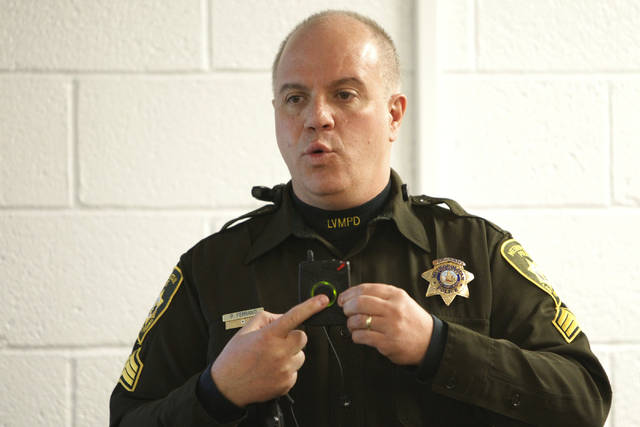 Las Vegas police Sgt. Peter Ferranti demonstrates the department's body cameras during a media ...