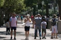 Tourists walk along Las Vegas Boulevard near the Bellagio fountains, June 7, 2020, in Las Vegas ...