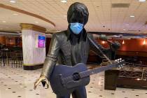 A masked statue of Elvis Presley is shown at Westgate Las Vegas on Thursday, June 18, 2020. (Jo ...