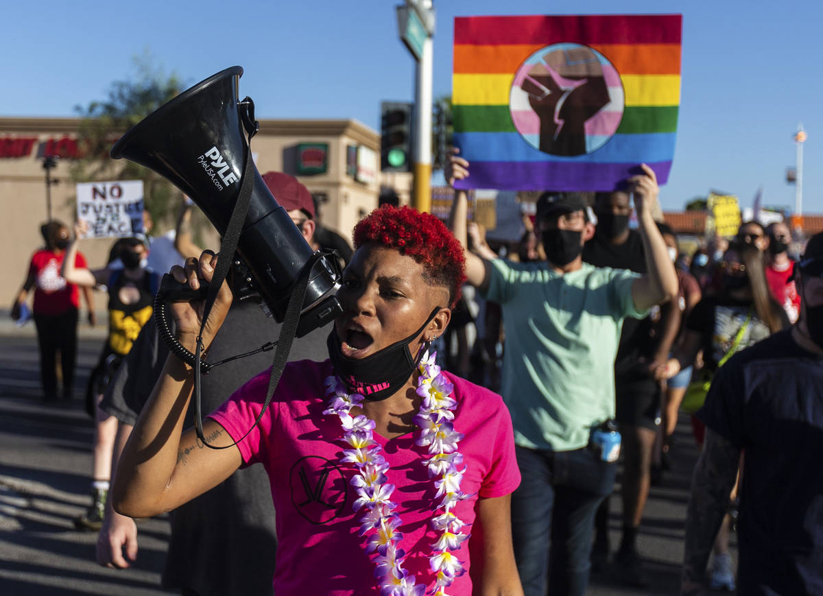Zyera Dorsey leads protesters during march on Sahara Avenue during a Juneteenth rally organized ...
