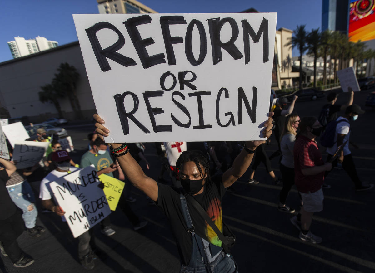 Protesters march west on Sahara Avenue during a Juneteenth rally organized by Black Lives Matte ...