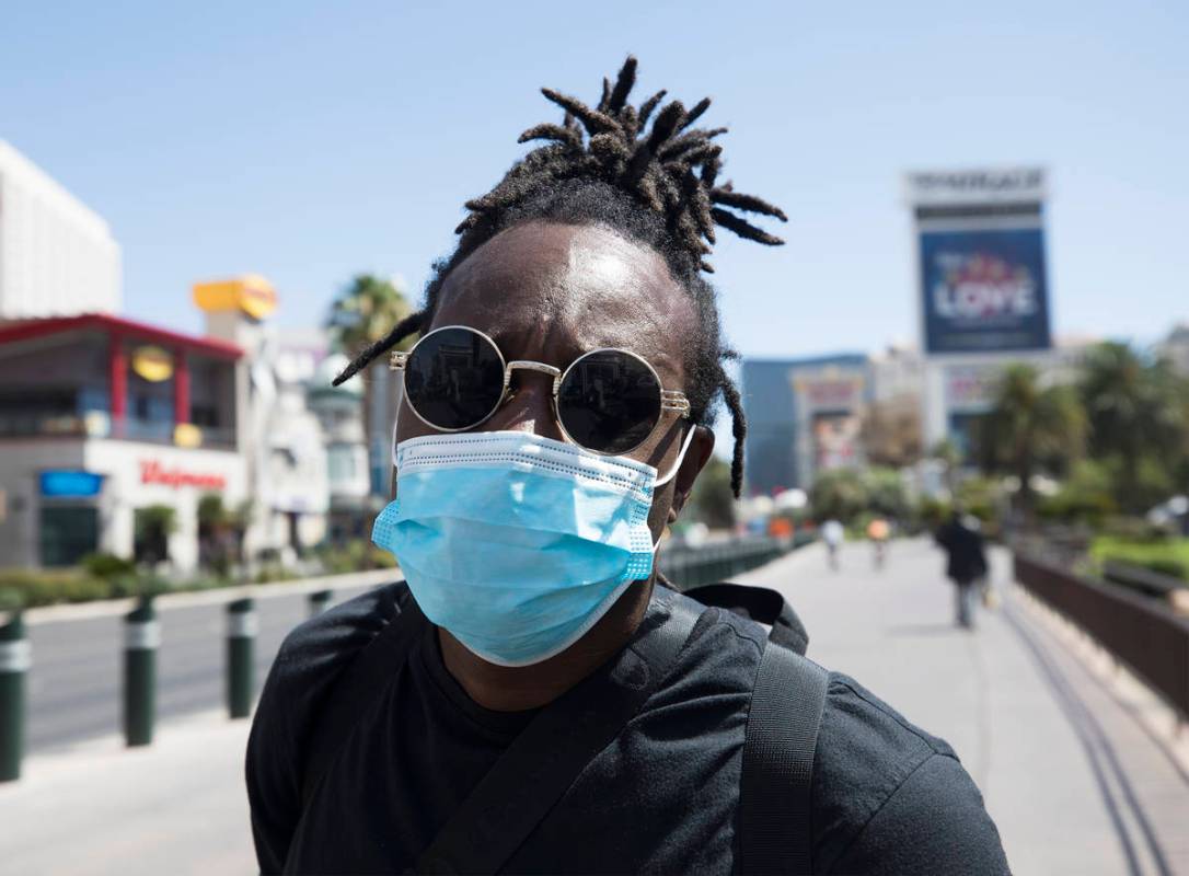 Antonio Skiiboski Wheeler, of Orlando, shows his mask on the Strip in Las Vegas, Sunday, June 2 ...