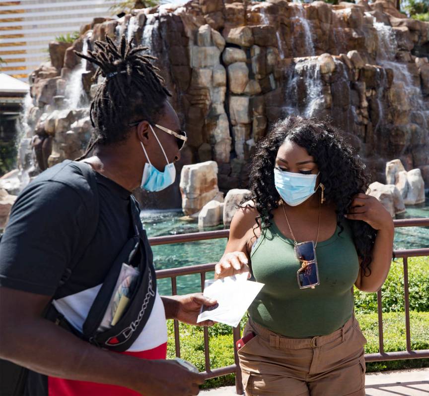 Antonio Skiiboski Wheeler, left, of Orlando, sells a CD to Alicia Rogan, of St. Louis, on the S ...