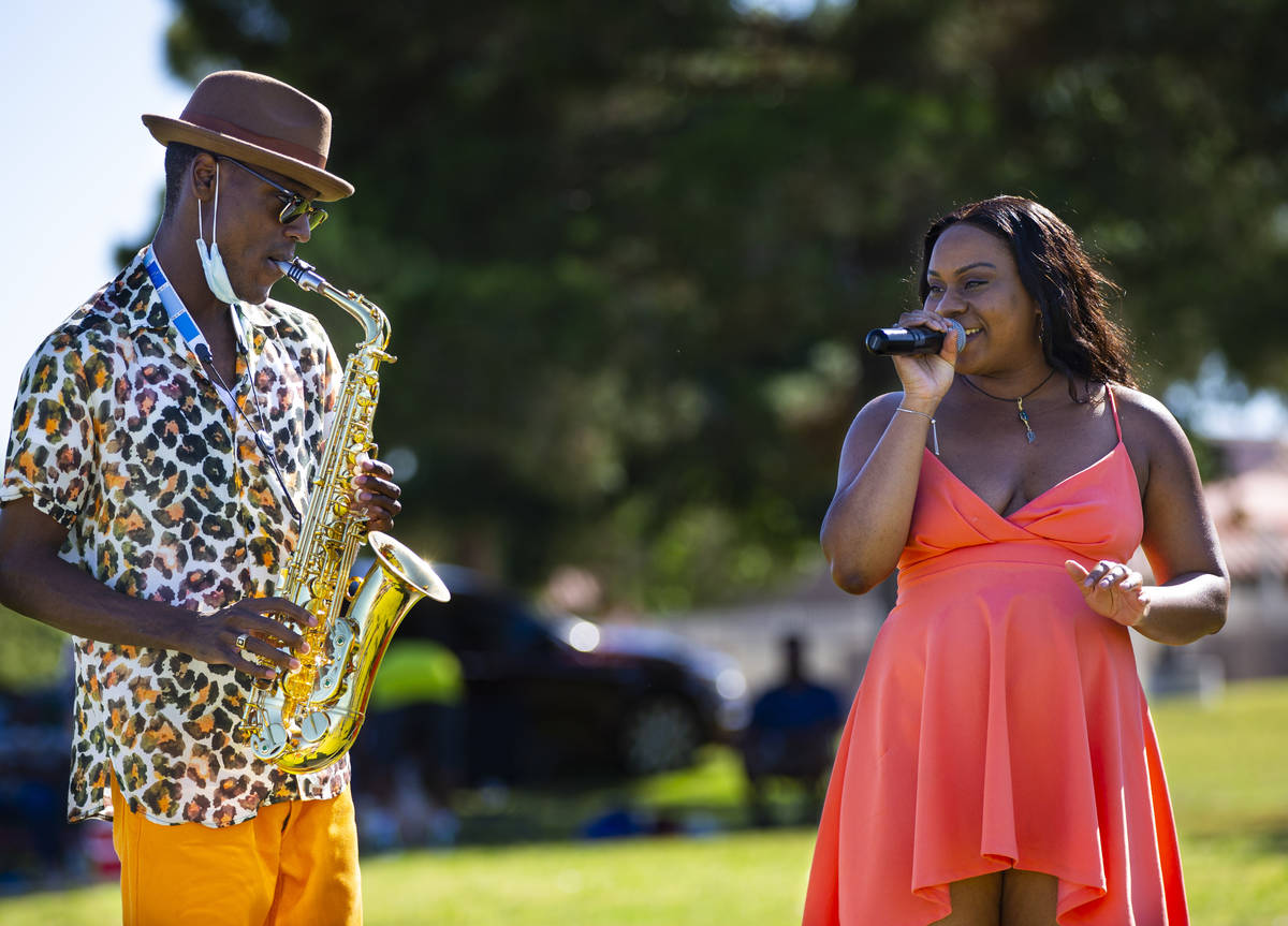 Jimi Duck, left, and Brittany Soul, of Las Vegas, perform during a Juneteenth event held by Sav ...