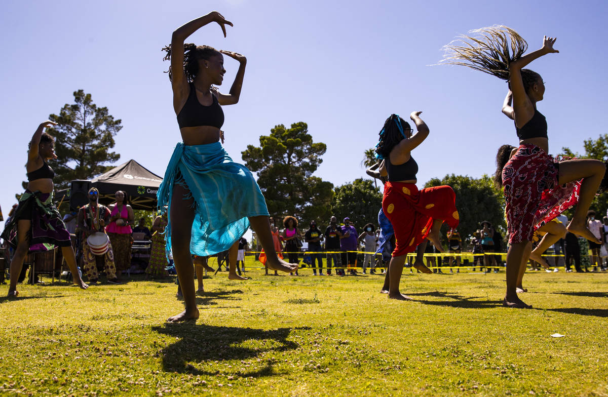 Members of Olabisi African Dance & Drum Ensemble perform during a Juneteenth event held by ...