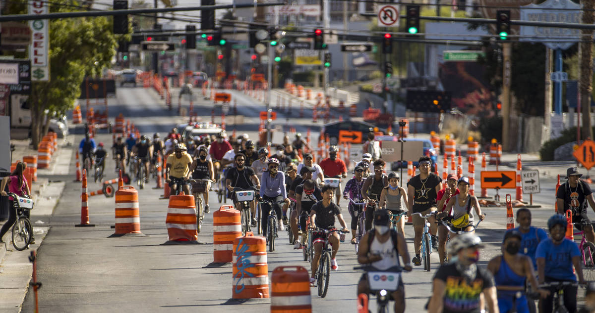 Participants in a Black Lives Matter bike ride against injustice ride down the Las Vegas Strip ...
