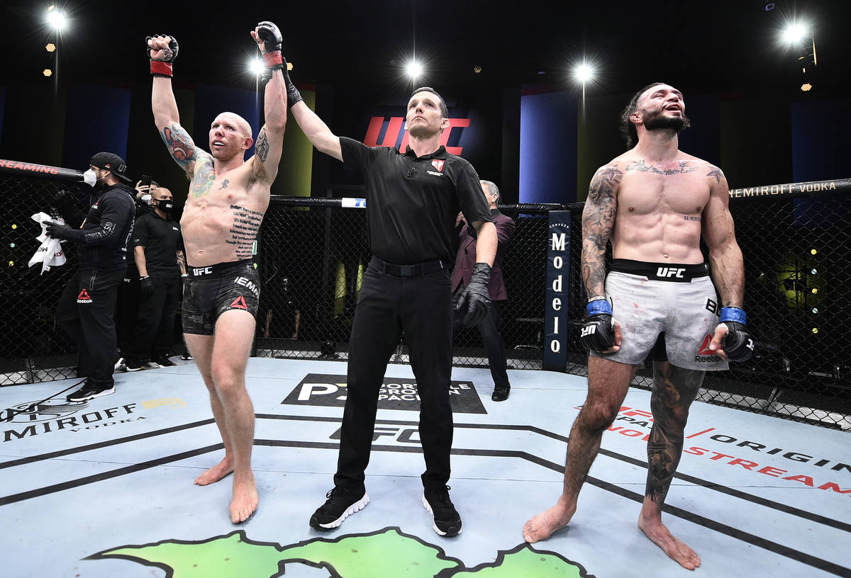 LAS VEGAS, NEVADA - JUNE 20: Josh Emmett reacts after his decision victory over Shane Burgos in ...