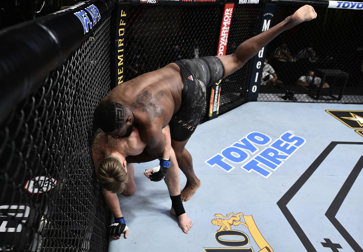 LAS VEGAS, NEVADA - JUNE 20: Curtis Blaydes takes down Alexander Volkov of Russia in their heav ...