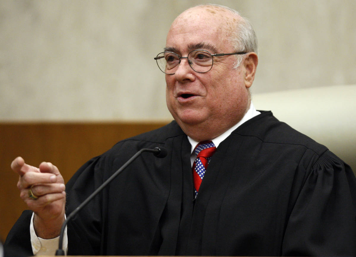 FILE - In this May 1, 2008 file photo, U.S. District Judge Royce C. Lamberth is seen during a c ...