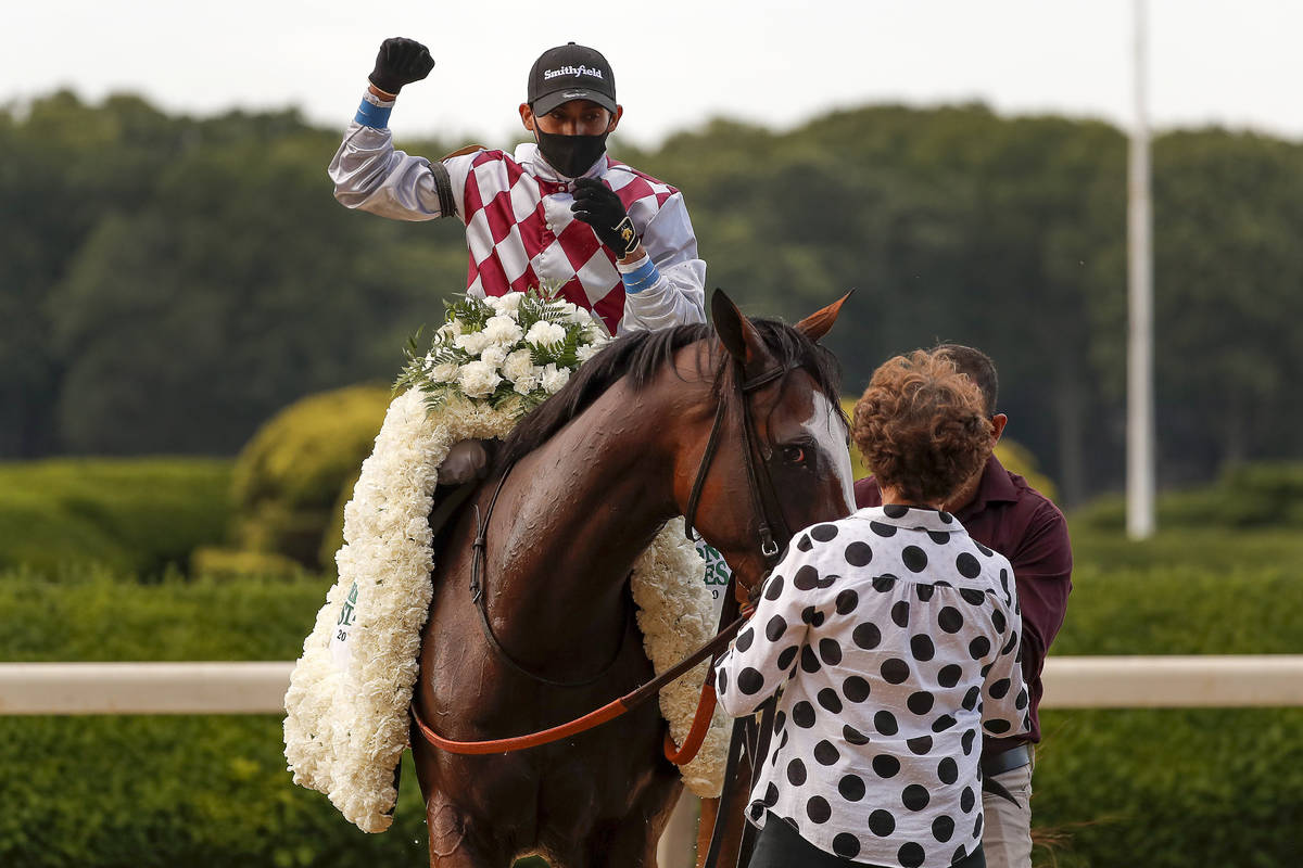 Manny Franco reacts after winning the 152nd running of the Belmont Stakes horse race with Tiz t ...