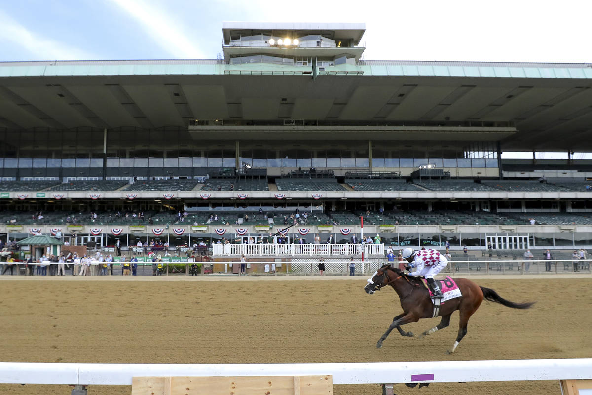 Tiz the Law (8), with jockey Manny Franco up, crosses the finish line in front of an empty gran ...