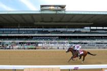 Tiz the Law (8), with jockey Manny Franco up, crosses the finish line in front of an empty gran ...