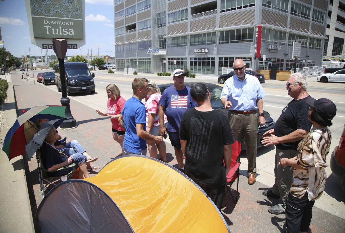FILE - In this June 15, 2020, file photo Donald Trump supporters gather outside the BOK Center ...