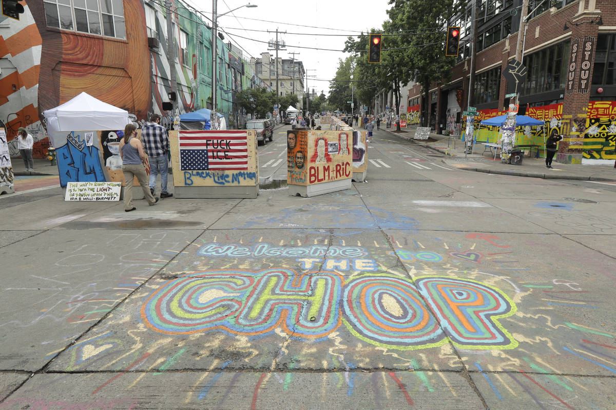 A sign on the street reads "Welcome to the CHOP," Saturday, June 20, 2020, inside wha ...