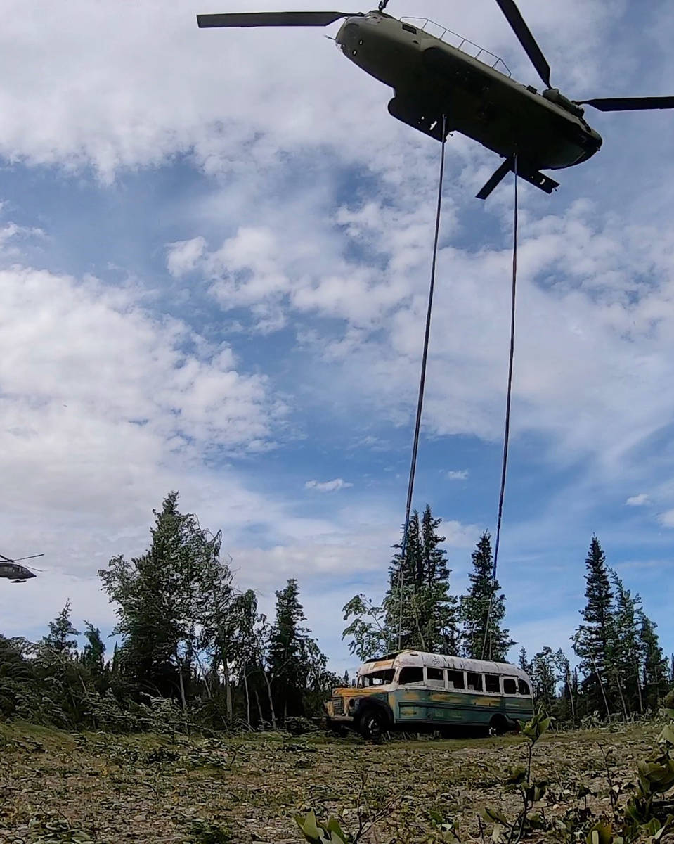 In this photo released by the Alaska National Guard, Alaska Army National Guard soldiers use a ...