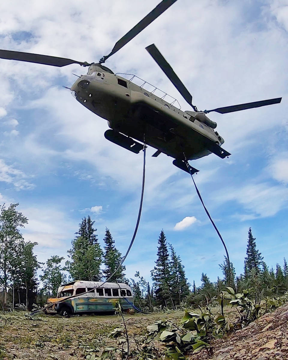 In this photo released by the Alaska National Guard, Alaska Army National Guard soldiers use a ...