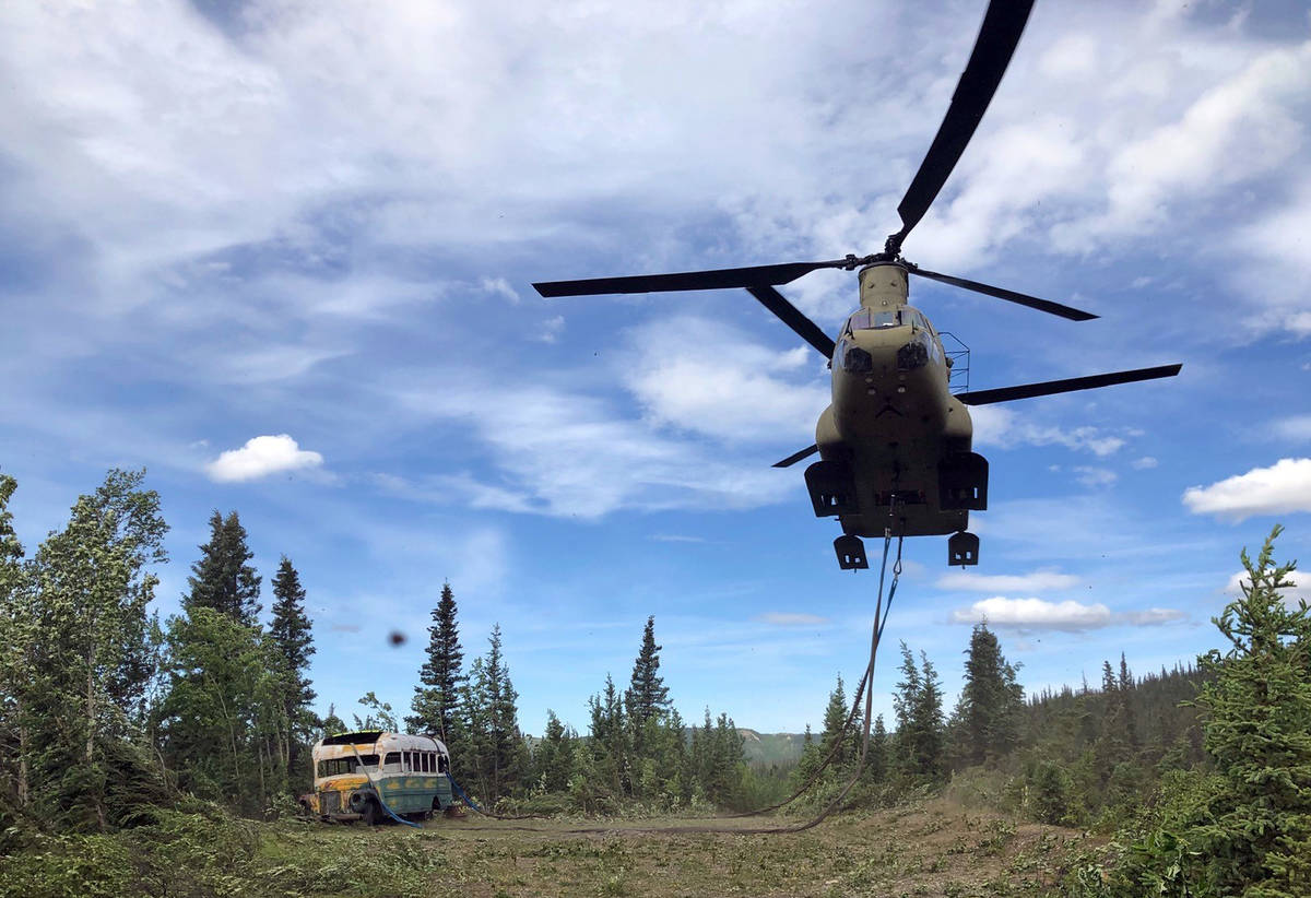 In this photo released by the Alaska National Guard, Alaska Army National Guard soldiers use a ...