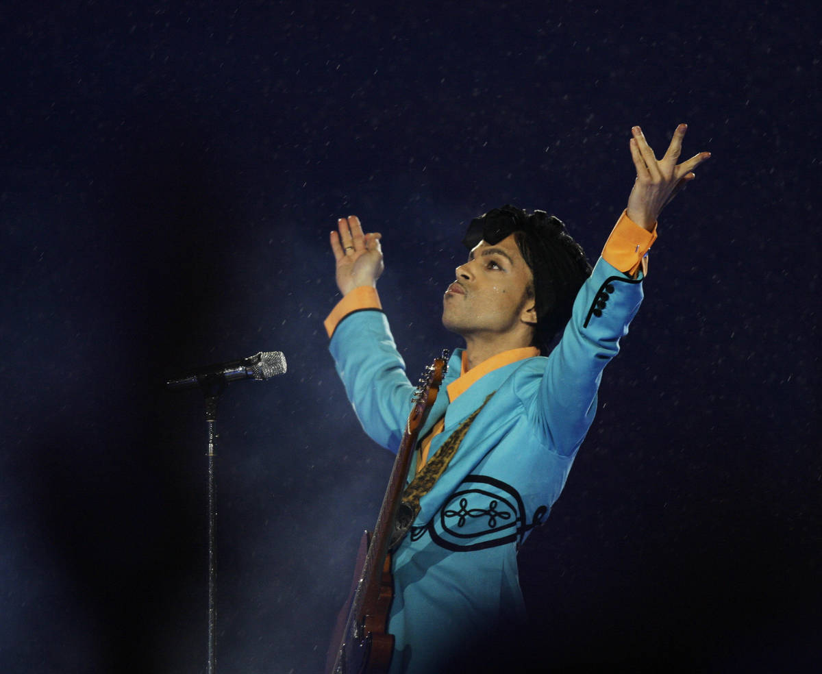 FILE- In this Feb. 4, 2007, file photo, Prince performs during the halftime show at Super Bowl ...