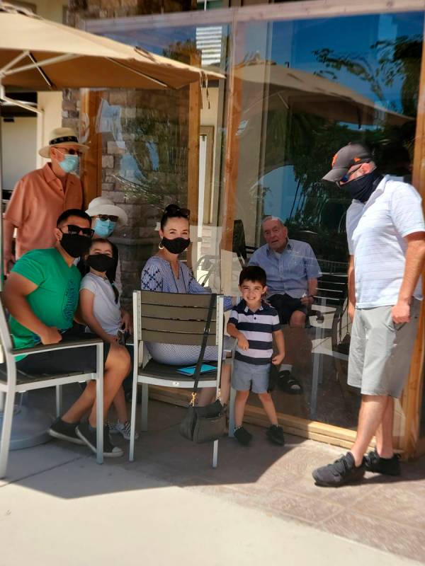 This handout photo provided by his family shows 93-year-old Wake Sharp, second from right behin ...