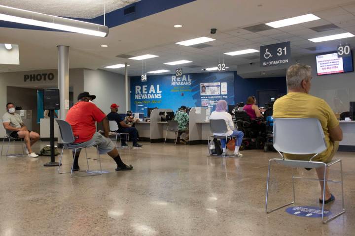 People near the finish line after long wait times at the Nevada Department of Motor Vehicles at ...