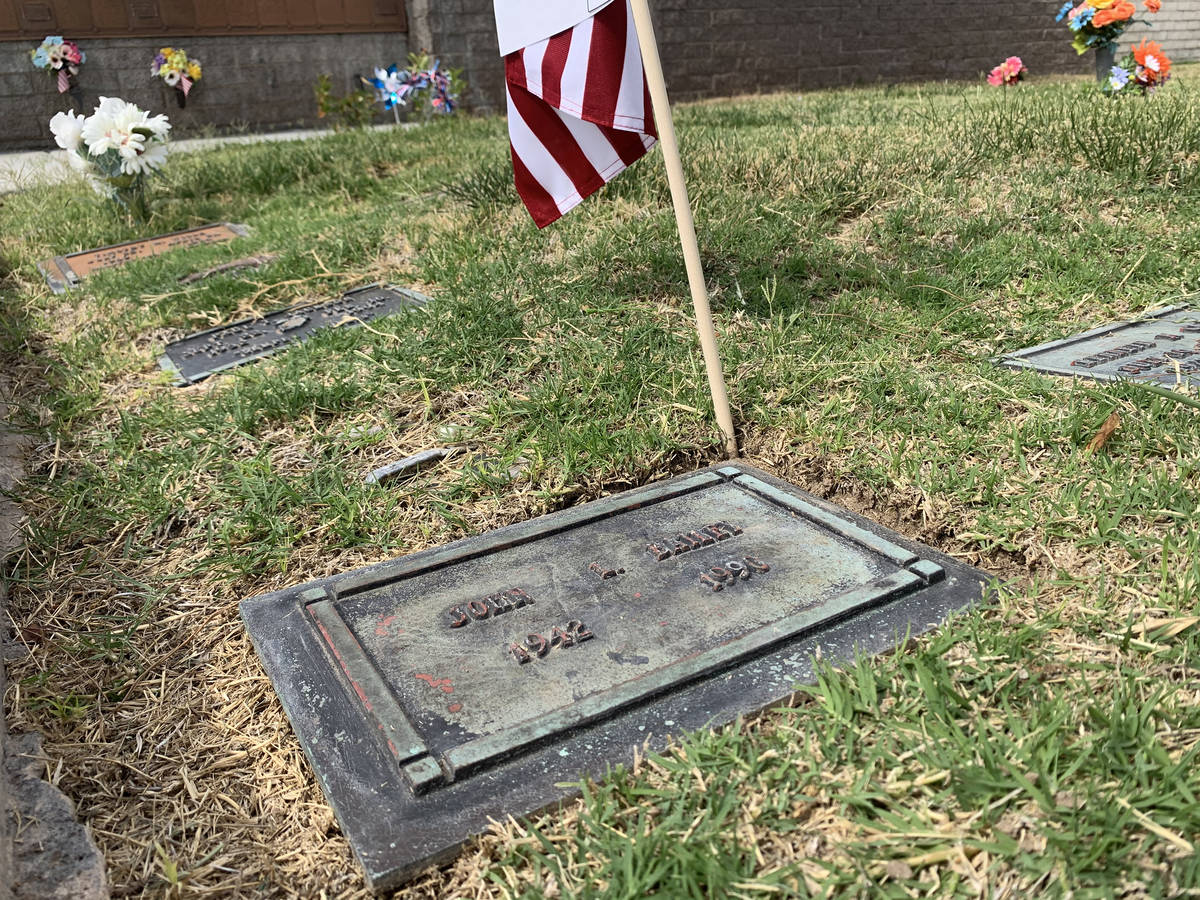 The gravesite of FBI Special Agent John Bailey is seen with an American flag on Thursday, June ...