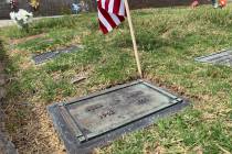 The gravesite of FBI Special Agent John Bailey is seen with an American flag on Thursday, June ...
