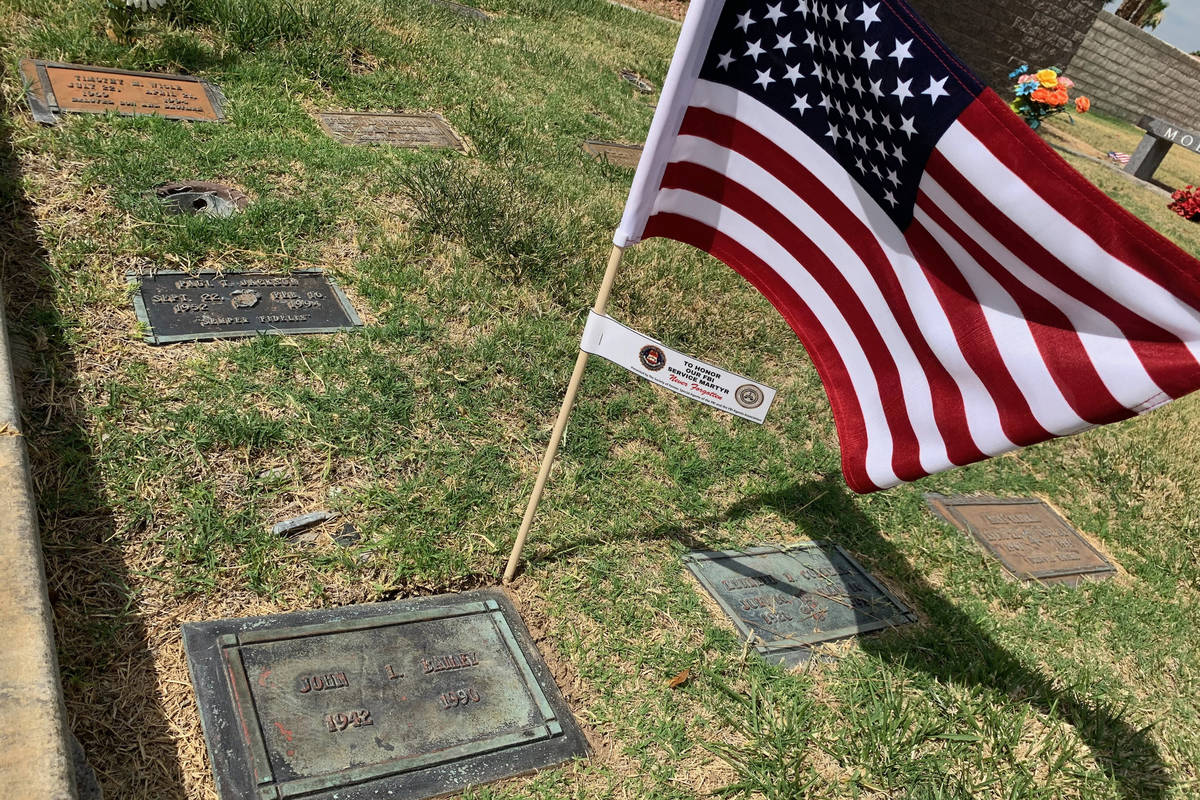 The gravesite of FBI Special Agent John Bailey is seen with an American flag on Thursday, June ...