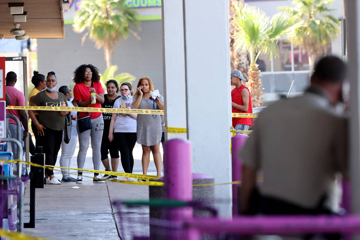 Las Vegas police investigate a shooting at the 99 Cents Only Store on North Rancho Drive at Che ...