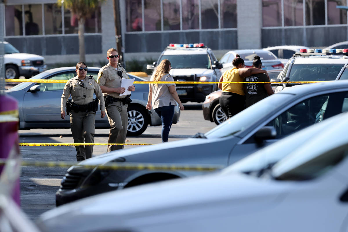 Las Vegas police investigate a shooting at the 99 Cents Only Store on North Rancho Drive at Che ...