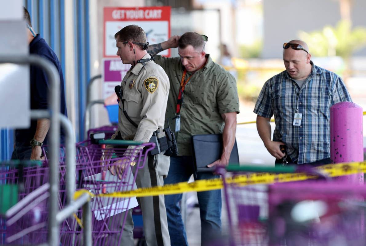 Las Vegas police investigate a shooting at the 99 Cents Only Store on North Rancho Drive at Che ...
