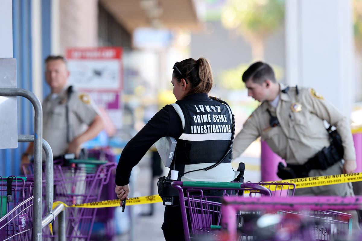 Las Vegas police investigate a shooting at the 99 Cents Only Store on North Rancho Drive at Che ...