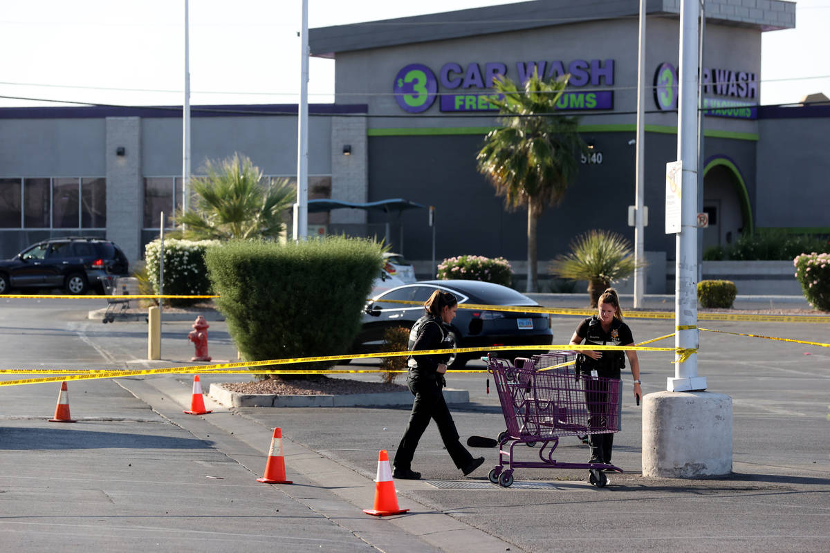 Las Vegas police investigate a shooting at the 99 Cents Only Store on North Rancho Drive at Che ...