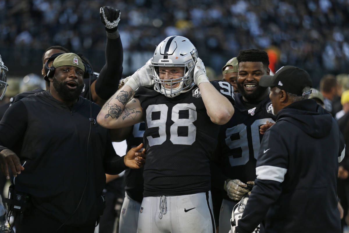 Oakland Raiders defensive end Maxx Crosby (98) on the bench during the second half of an NFL fo ...