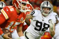 Oakland Raiders defensive end Maxx Crosby (98) chases Kansas City Chiefs quarterback Patrick Ma ...