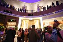 Guests explore the conservatory during opening night at MGM National Harbor hotel-casino in Oxo ...