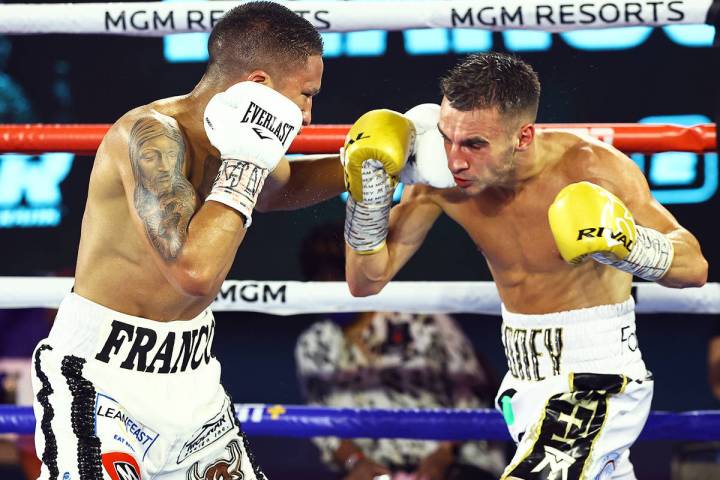 Joshua Franco, left, lands a left punch against Andrew Moloney on Tuesday, June 23, 2020, at th ...