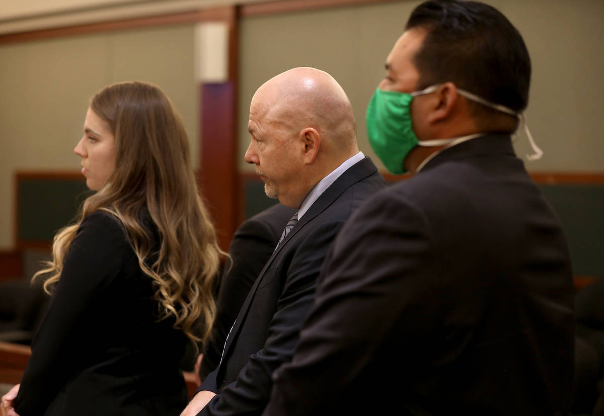 Defense attorneys Colleen Savage, left, Tony Sgro, center, and defendant former director with t ...