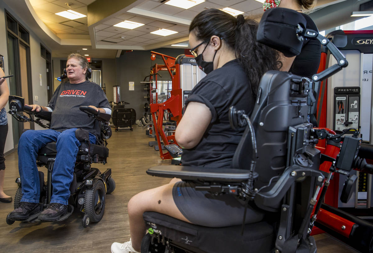 Quadriplegic IndyCar team owner Sam Schmidt, left, talks about the upcoming free virtual workou ...