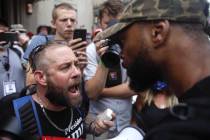 Scott Hilliard, left, argues with Black Lives Matter protester Eugene Smith ahead of President ...