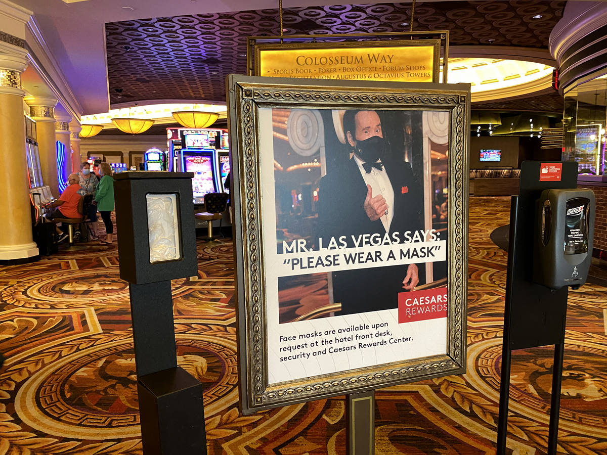Mr. Las Vegas Wayne Newton appears in a reminder to wear face masks at Caesars on the Strip in ...