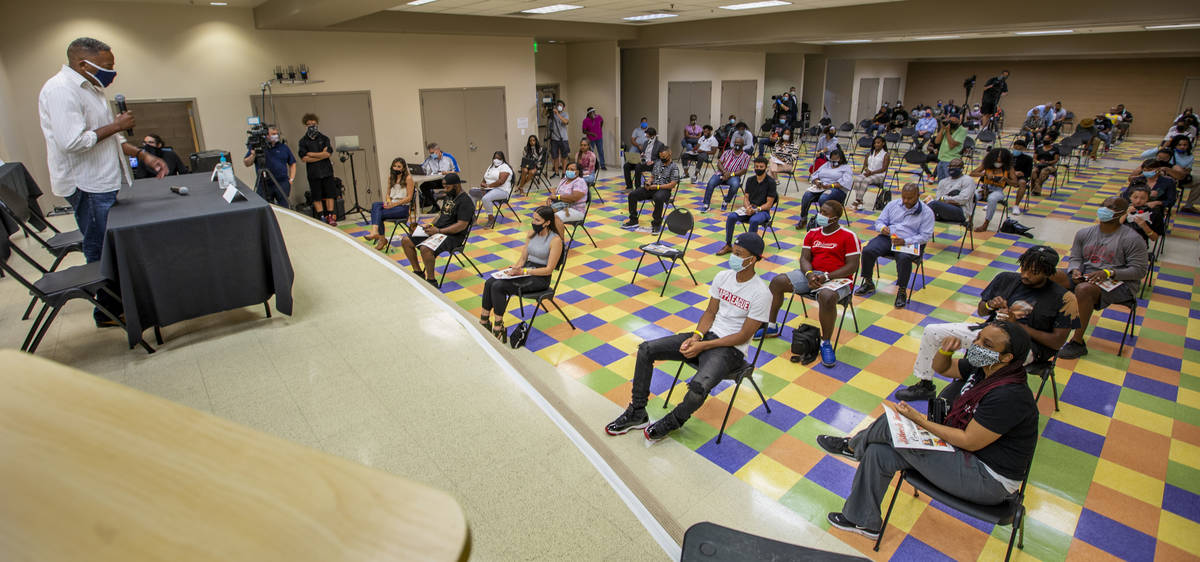 Clark County Commission Vice Chairman Lawrence Weekly, left, hosts a Solutions, Strategies &amp ...